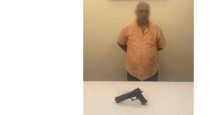 ضبط بلطجي هدد جارة بسلاح ناري لخلافات الجيرة بالجيزة